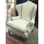 WING ARMCHAIR, Georgian style walnut in close nailed ticking with loose cushion seat, 83cm W.