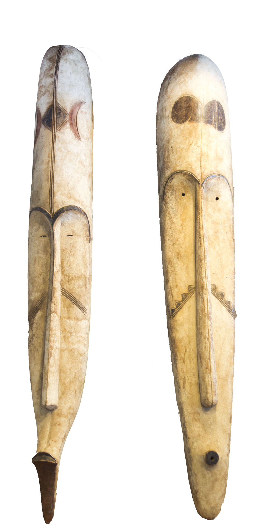 FANG FACE MASKS, two similar, West African carved and painted wood of large size,