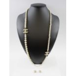 CHANEL CC PEARL NECKLACE AND MATCHING EARRINGS with graduating faux pearls, signed Chanel 14A,