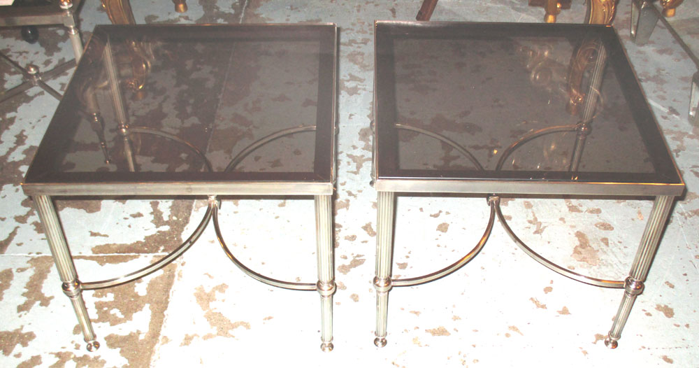 LAMPS TABLES, a pair, silvered metal Regency design each with tinted glass and X stretcher,