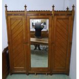 GOTHIC REVIVAL TRIPLE WARDROBE, in the manner of Charles Bevan,
