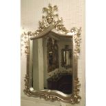 WALL MIRROR, silvered frame with carved detail, 83cm W x 130cm H.