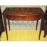 HALL TABLE, George III flame mahogany of adapted bow outline, 70cm H x 84cm x 45cm.