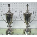 TABLE LAMPS, a pair, in the shape of trophies, 67cm H.