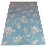CONTEMPORARY CARPET, 250cm x 160cm, floral designs in sky blue and ivory.