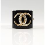 CHANEL CUFF BRACELET Swarovski crystals set in black resin,