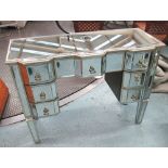 MIRRORED DESK, with seven drawers below on square supports, 100cm x 36cm x 80cm H.