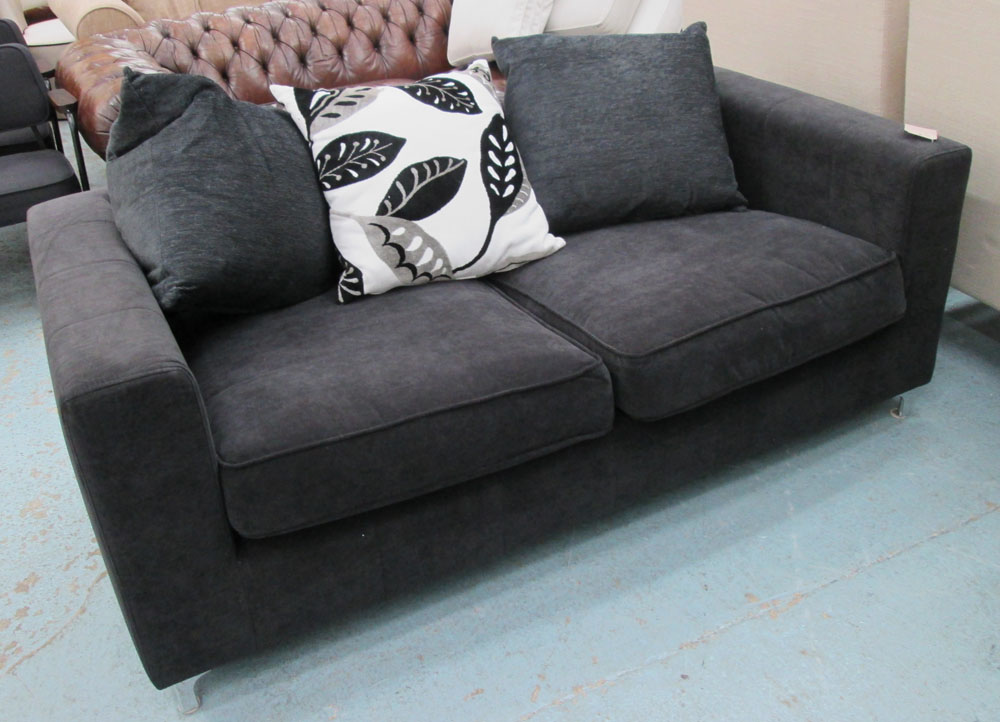 SOFA, two seater, black on chromed metal supports with three scatter cushions, 184cm L.