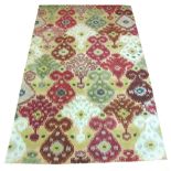 CONTEMPORARY CARPET, 250cm x 160cm, in a vibrant Ikat design.