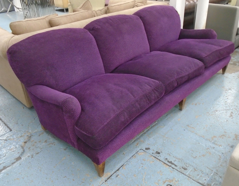 GEORGE SHERLOCK SOFA, three seater, Howard style, in Andrew Martin purple fabric,