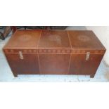 TRUNK, in a burnt umber leather with metal stud work,