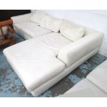 CORNER SOFA, in cream, on metal supports, 281cm x 176cm.