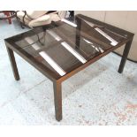 OCCASIONAL TABLE, glass top on brass base, with square supports, 92cm x 69cm x 45cm H.