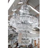 CHANDELIER, three branches, cascade style with glass drops on a chromed metal frame, 71cm H,