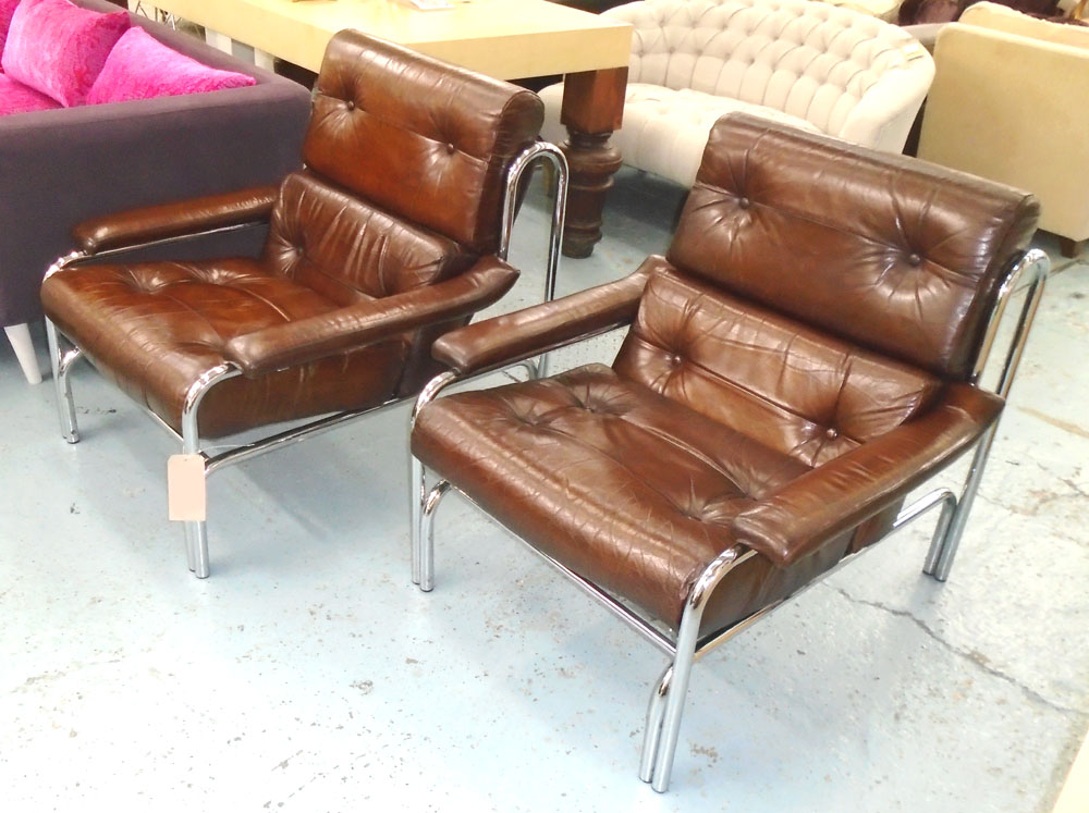 ARMCHAIRS, a pair, by 'Pieff' 1970's chestnut brown leather upholstered and chromed framed, 84cm W.