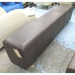 OTTOMAN, in a burnt umber leather, on a long wooden support, 179cm L.