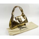 BURBERRY HANDBAG, gilt finished leather with two adjustable handles,