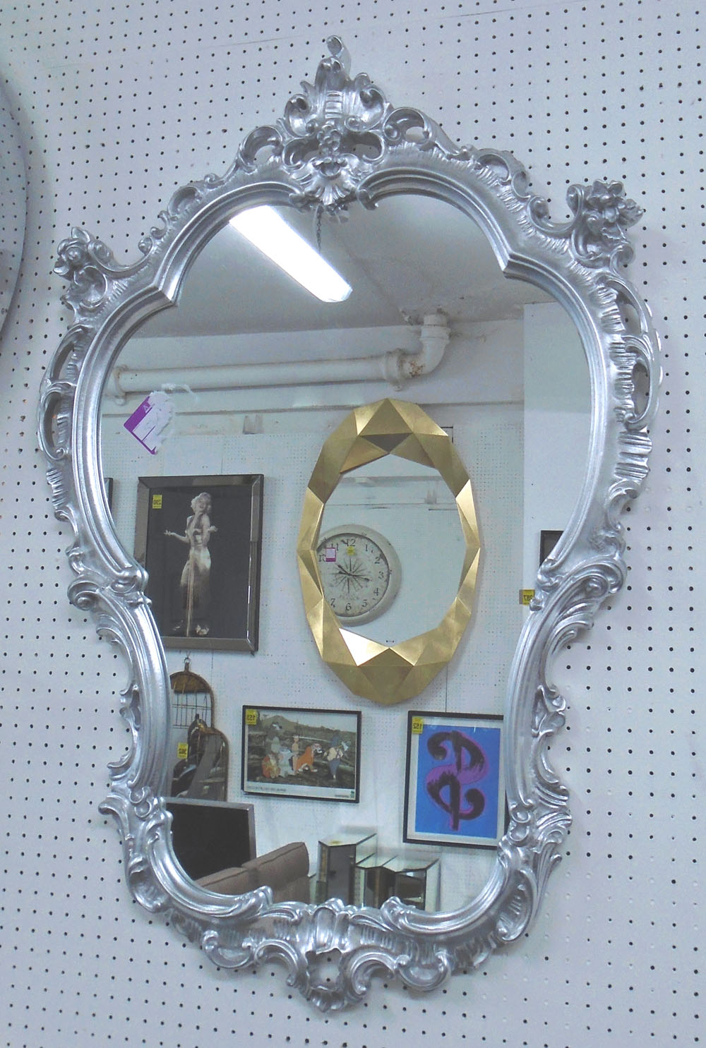 LOOKING GLASS, the shaped plate and silvered frame in Rococo style, 99cm H x 64cm W.