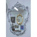 LOOKING GLASS, the shaped plate and silvered frame in Rococo style, 99cm H x 64cm W.