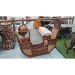 PALANQUIN, for two, carved teak with caned seats and bamboo carrying pole,