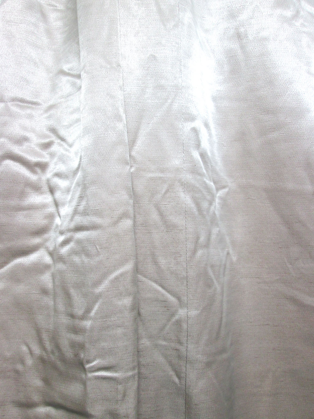 CURTAINS, a pair, lined and interlined, not gathered, in shimmering cream silk,