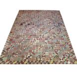 FINE MODERNIST CARPET, 327cm x 253cm, with multiple panels of geometric design.