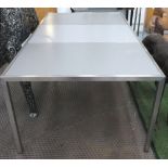 DINING TABLE, with three sectioned top, on a stainless steel frame, with square supports,