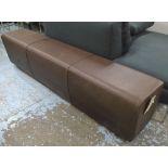 OTTOMAN, in burnt umber leather, on long wooden supports, 178cm L.