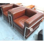 ARMCHAIRS, a pair, Le Corbusier design tubular chrome framed with tan leather cushions, 77cm W.