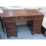 PEDESTAL DESK, with a rectangular tan leather tooled top and nine drawers below, 121.5cm W x 76.