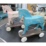 WOODEN TOY HORSES ON WHEELS, a matched pair, weathered paint finish, 1950's style, 50cm H x 48cm.