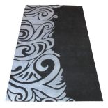 CONTEMPORARY CARPET, 244cm x 152cm, stylised organic motifs in en gris and noir.