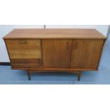 SIDEBOARD, 1960s teak with cupboard and drawers on turned supports, 146cm x 46cm x 84cm H.