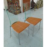 ROCHE BOBOIS DINING CHAIRS, a set of six, with lucite backs leather seats and metal supports,