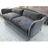 MOREAU SOFA, by Russell Pinch with a hump back and grey velvet upholstery, £4774 at The Conran Shop,