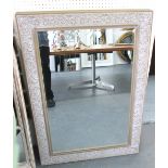 MIRRORS, a pair, with bevelled plate, in silver painted frames, 109cm x 78cm.