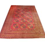 VINTAGE AFGHAN BASHIR CARPET, 365cm x 267cm, linear tribal gul decoration in terracotta,