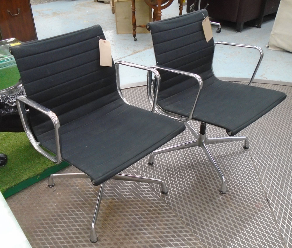 SWIVEL DESK CHAIRS, a pair, by Vitra designed by Eames with black cloth seats, 58cm W.