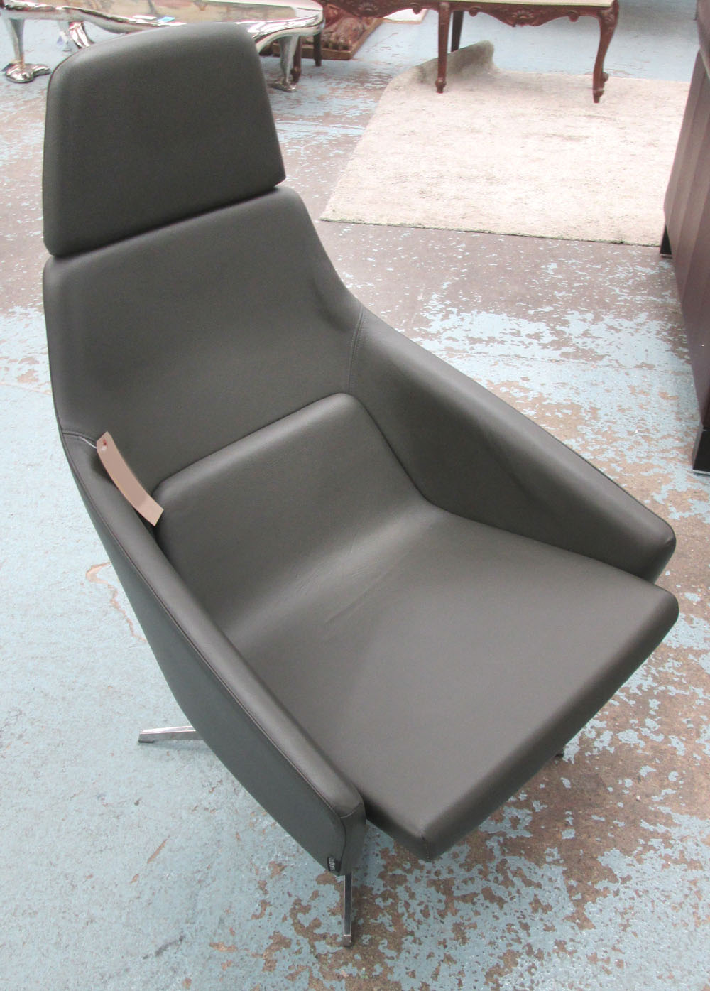 MODUS WRAP SWIVEL CHAIR, grey leather designed by Simon Pengelly, 71cm W.