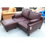 ROLF BENZ SOFA, two seater, in burgundy leather with two scatter cushions 144cm L (with faults),