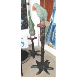 BRONZES, a near pair, of parrots, on perchin polychrome finish, 126cm and 122cm H.