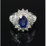 SAPPHIRE AND DIAMOND RING oval cut sapphire centered by round brilliant cut,