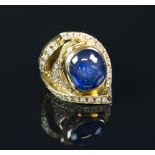 SAPPHIRE AND DIAMOND RING laid in 18K rose gold, sapphire cabochon 9.