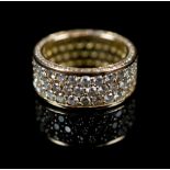 DIAMOND AND 18K GOLD ETERNITY RING triple row, pave set diamonds laid in rose gold, marked 750,