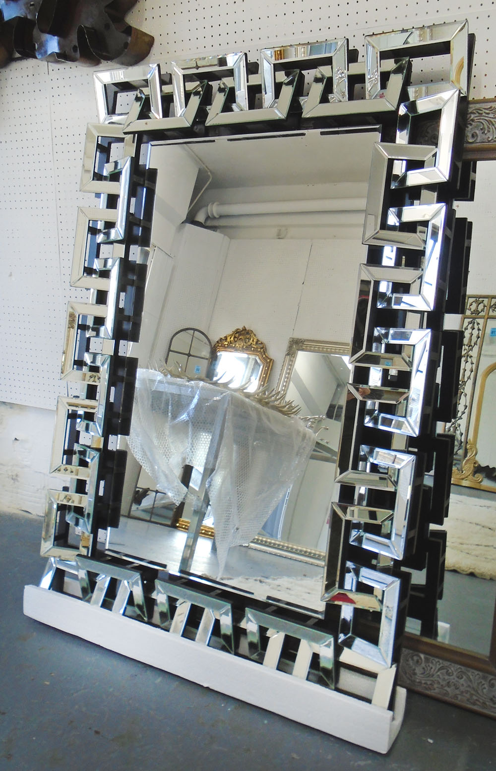 MIRROR, with bevelled plate with raised Greek key mirrored border, 118cm x 81cm.