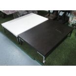 LOW TABLES, a matched pair, with chrome legs, one white and the other black, 120cm x 80cm x 31cm H.