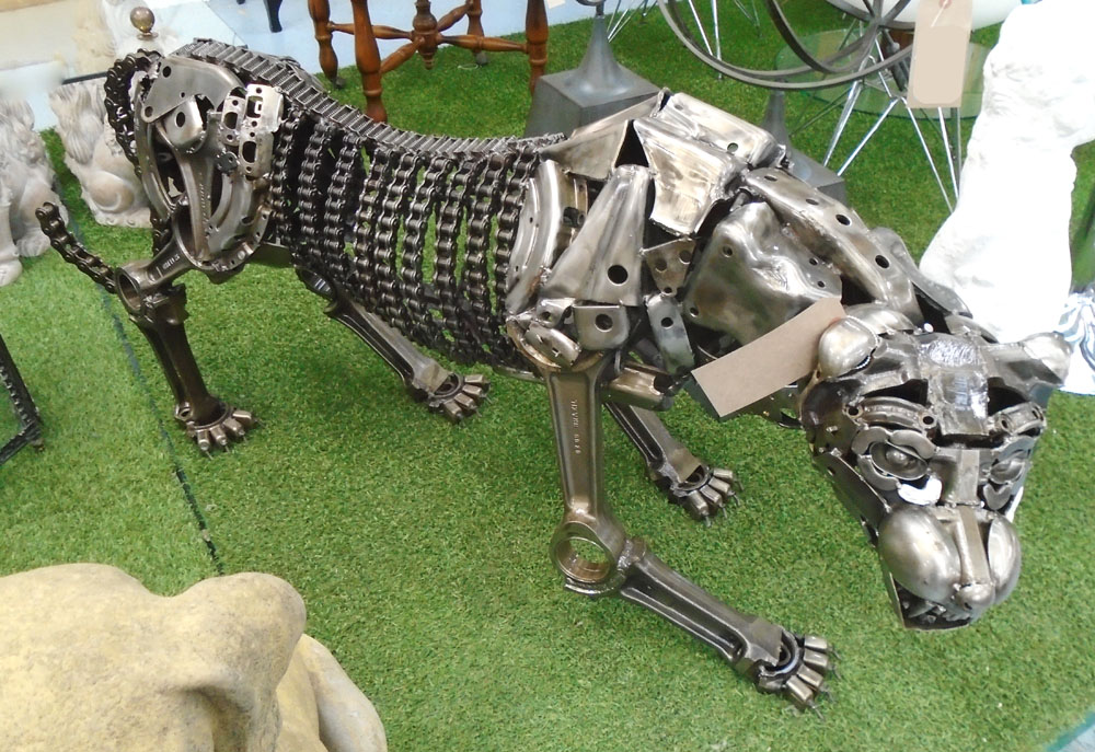 MACHINE PART SCULPTURE, of a panther, 145cm L x 62cm H.