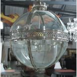 EICHHOLTZ HALL LANTERN, of globular form, polished metal with curved glass, 85cm H.