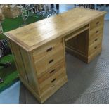 DESK, with six drawers in oak with military style handles in antique effect finish,