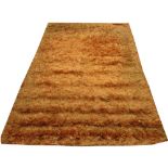 KELATY SILK SHAGGY RUG, 240cm x 170cm, contemporary vibrant orange design.